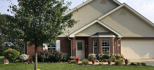 A charming suburban house with well-maintained landscaping.