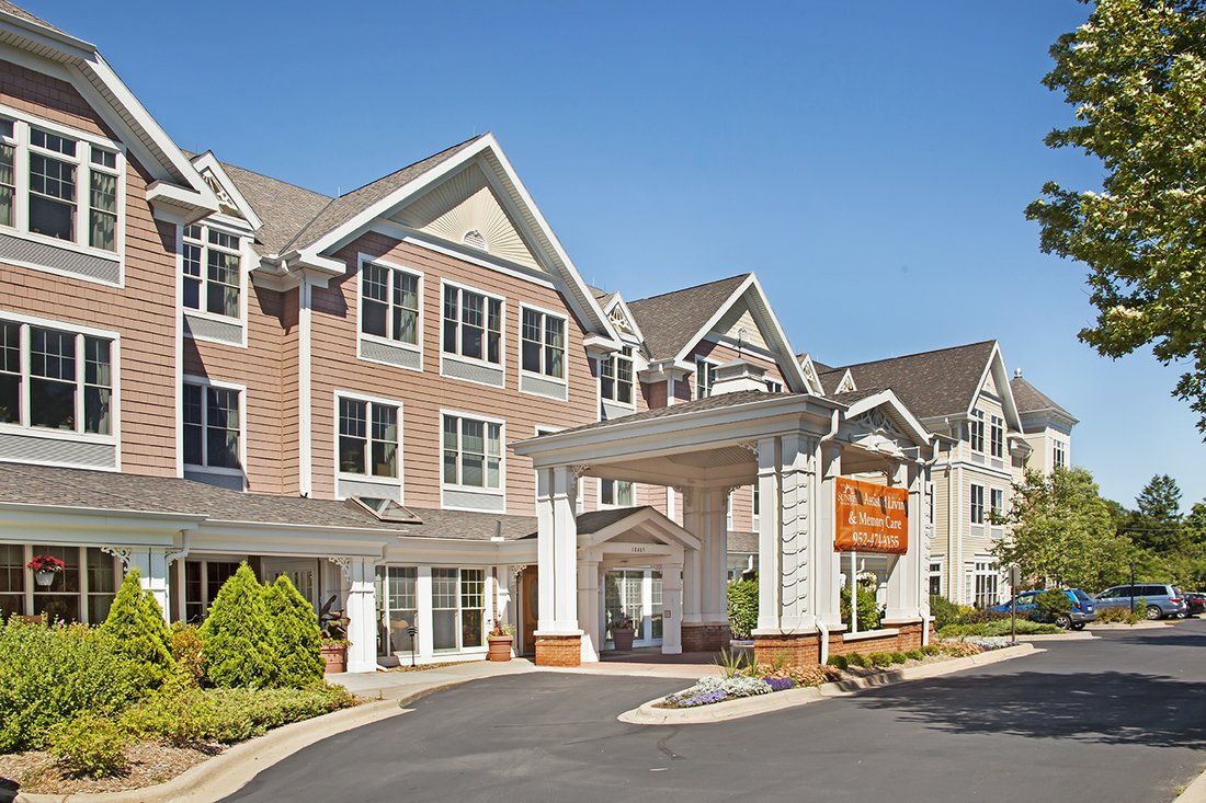 A modern residential building with a welcoming entrance on a sunny day.