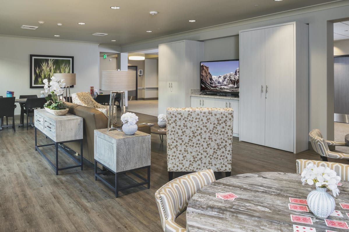 A modern living room with stylish furniture, a flat-screen television, and contemporary decor.