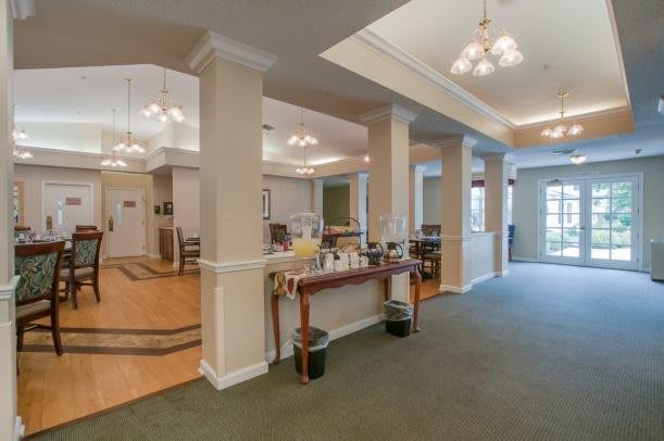 A well-lit reception area featuring elegant furniture and decor.