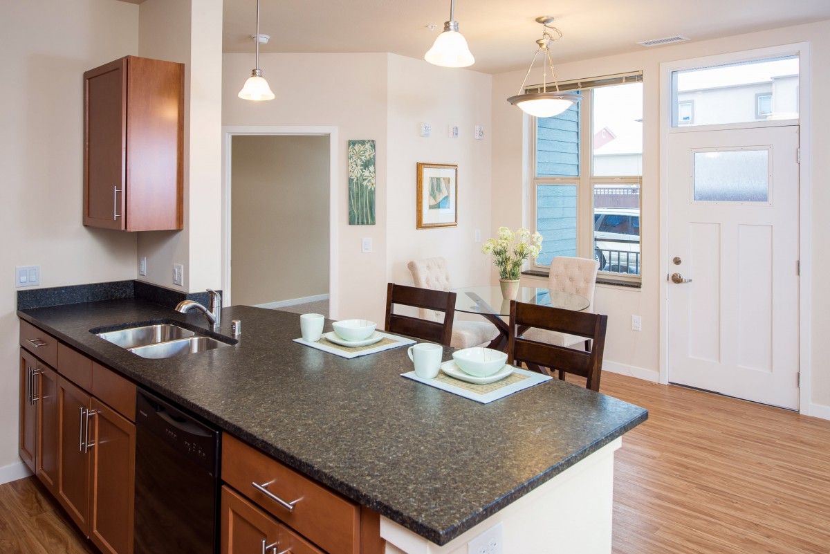 Modern kitchen and dining area with open layout.
