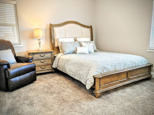 A cozy and elegantly furnished bedroom with a warm color palette.