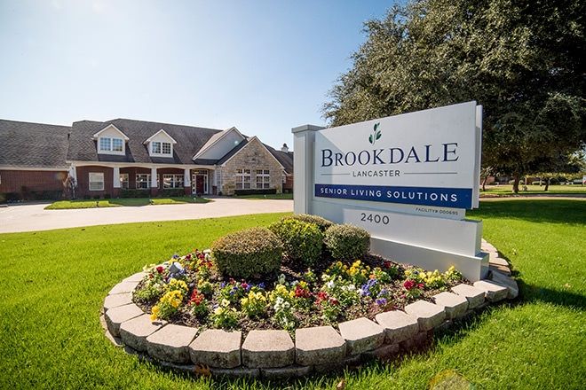 Entrance sign of a Brookdale senior living community with landscaped surroundings.