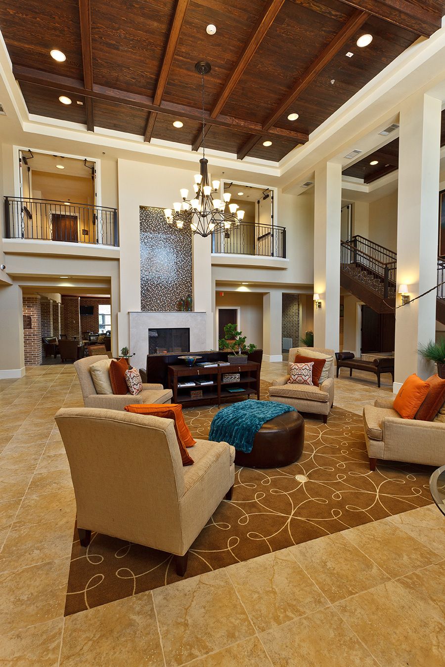 A luxurious, modern living room with high ceilings and elegant furniture.