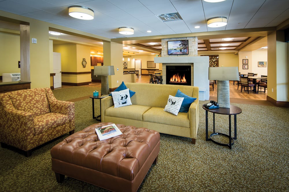 A cozy living room with a fireplace and comfortable seating.