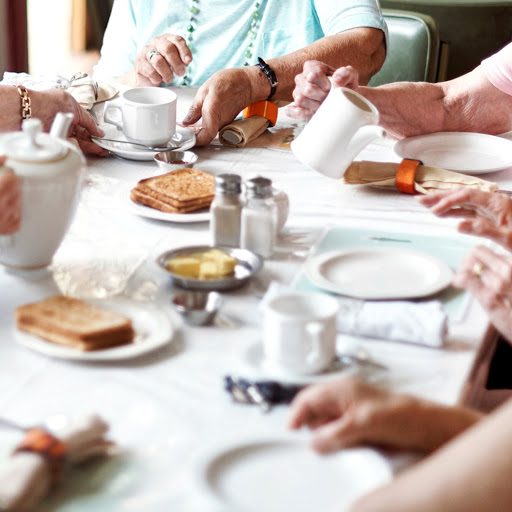 A delightful breakfast gathering with friends, sharing coffee and pastries.
