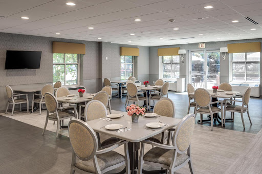 A beautifully arranged dining room with modern decor and ample seating.