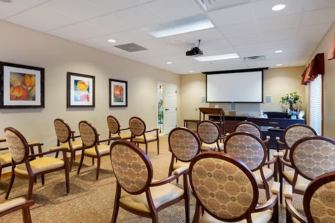 A small conference room with chairs arranged for a presentation or meeting.