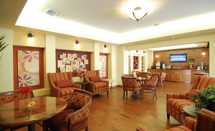 A cozy lounge area with comfortable seating and warm lighting.