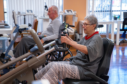 Seniors engaging in exercise therapy at a rehabilitation center.