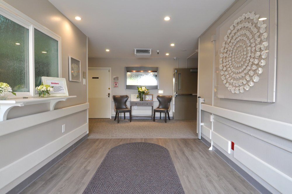 A modern interior lobby with seating and decorative artwork.