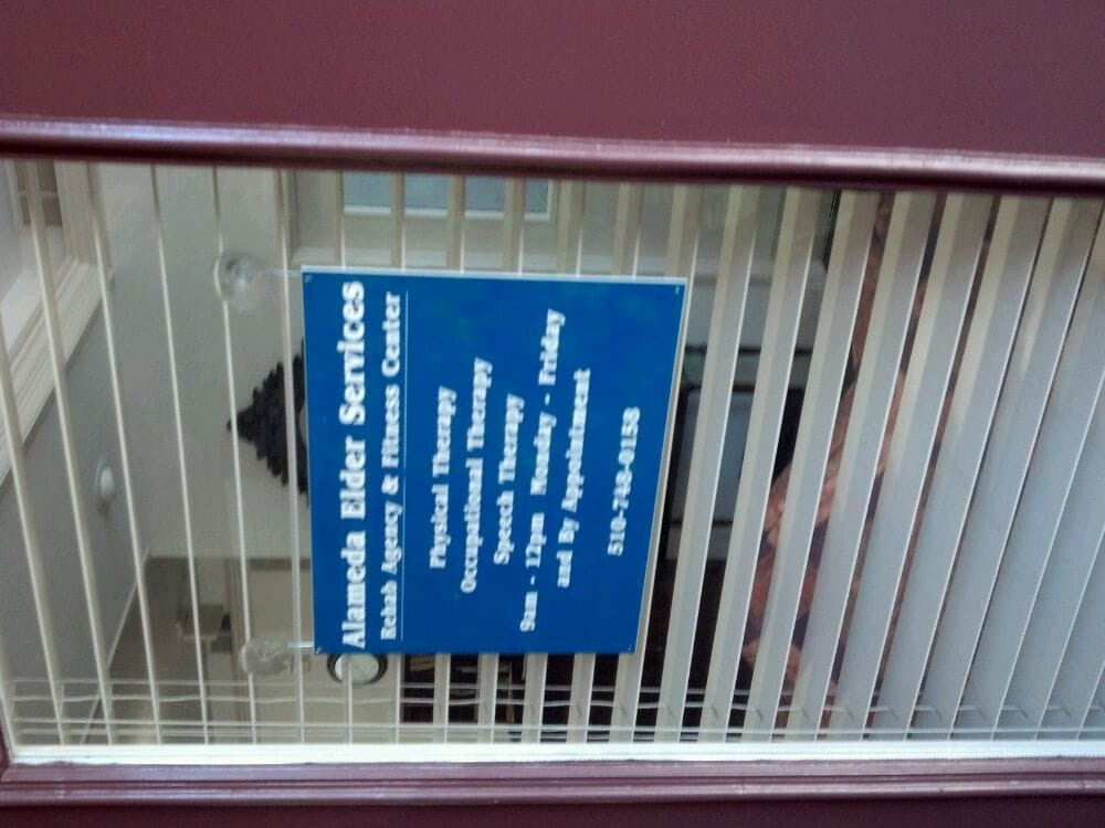 A sign displaying the office information and business hours for a water services provider.