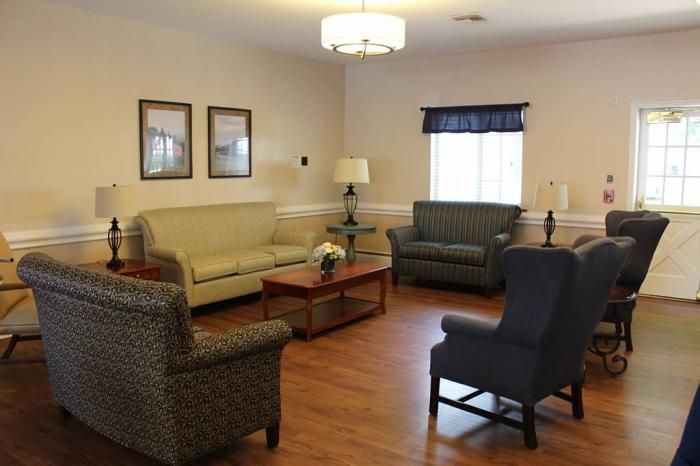 A cozy living room with comfortable seating and elegant decor.