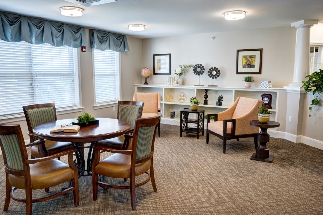 A cozy living room with stylish furniture and decorative artwork.