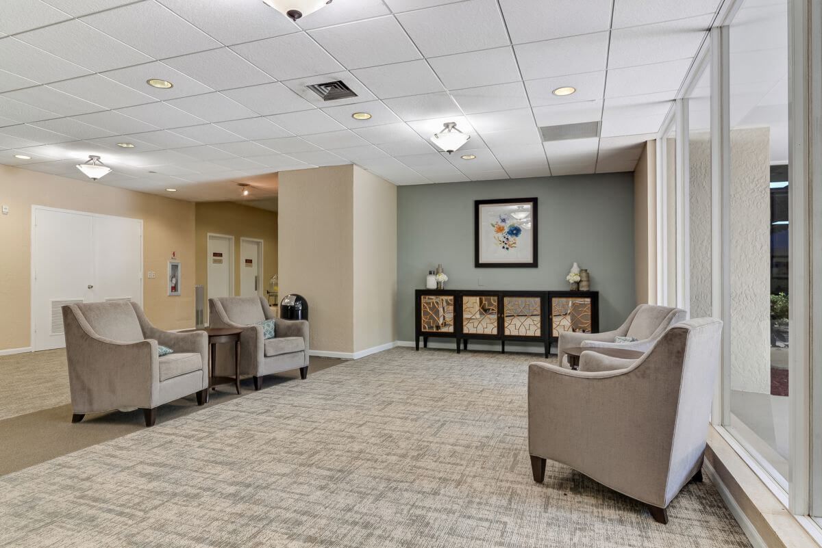 A well-lit lobby area with comfortable seating and tasteful decor.