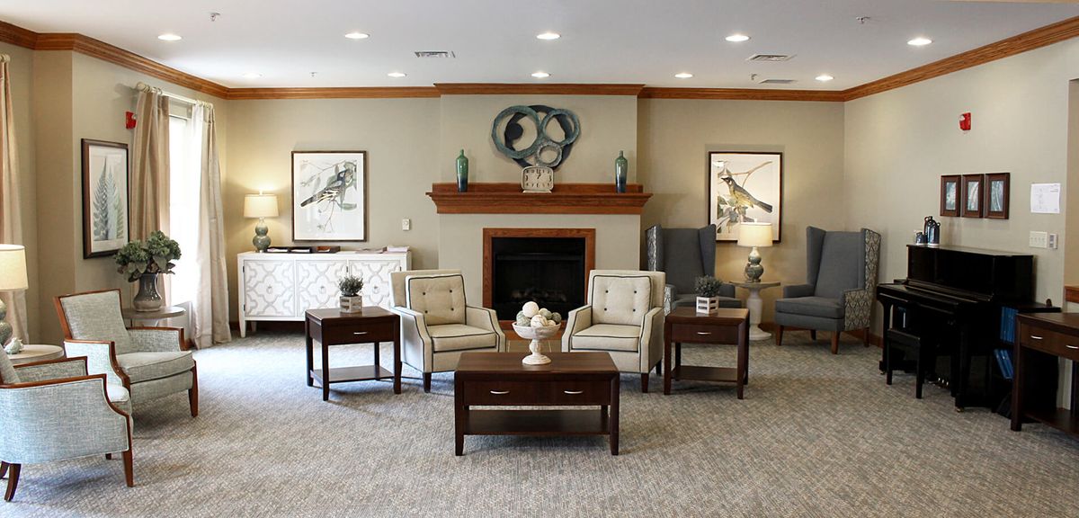 A cozy living room with comfortable seating and elegant decor.