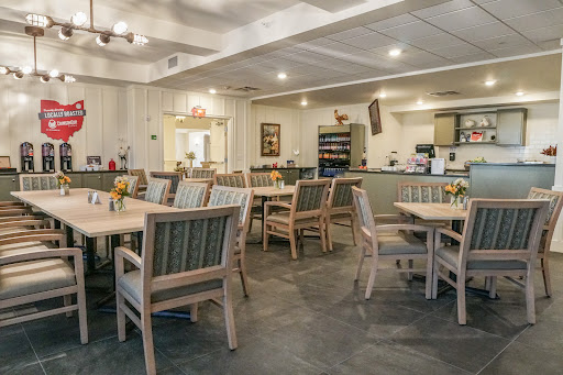 A cozy dining area featuring wooden furniture and a welcoming atmosphere.