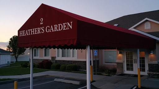 The entrance to a restaurant named 'Diner's Garden' with an awning.