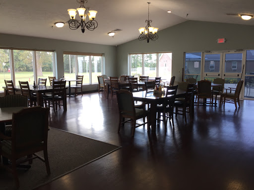A spacious and inviting dining area with multiple tables and natural light.