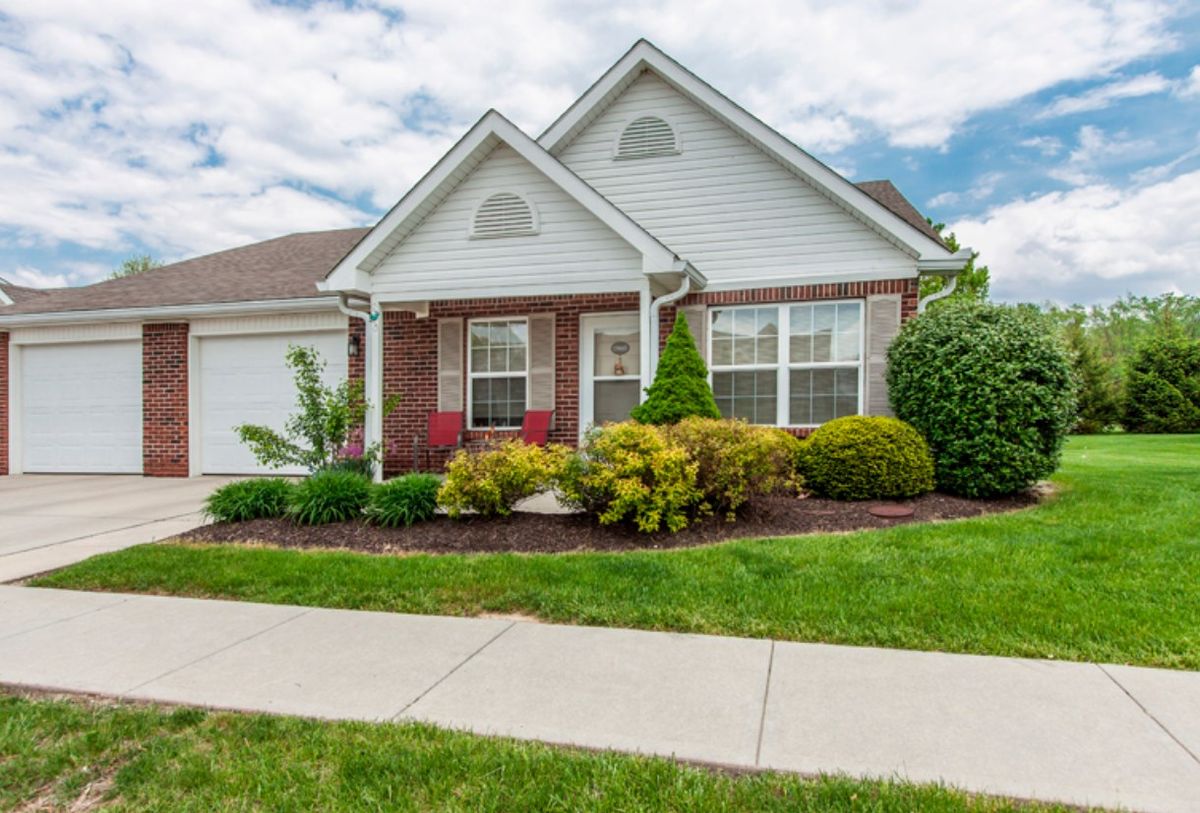 A well-maintained suburban house with manicured landscaping.