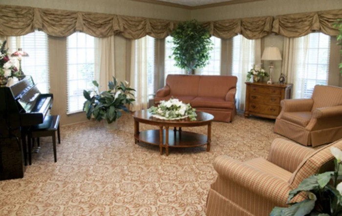 A cozy living room with elegant furniture and decor.