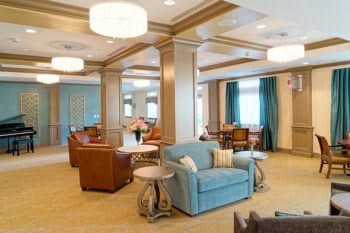 A modern lounge area with comfortable seating and elegant lighting.