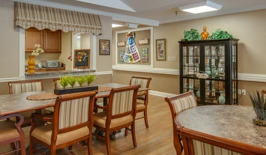 Cozy dining area with elegant wooden furniture and decor.