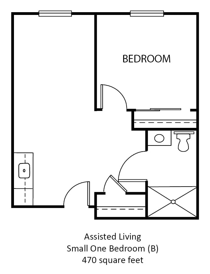 A floor plan of an assisted living apartment featuring a bedroom, bathroom, and kitchen area.