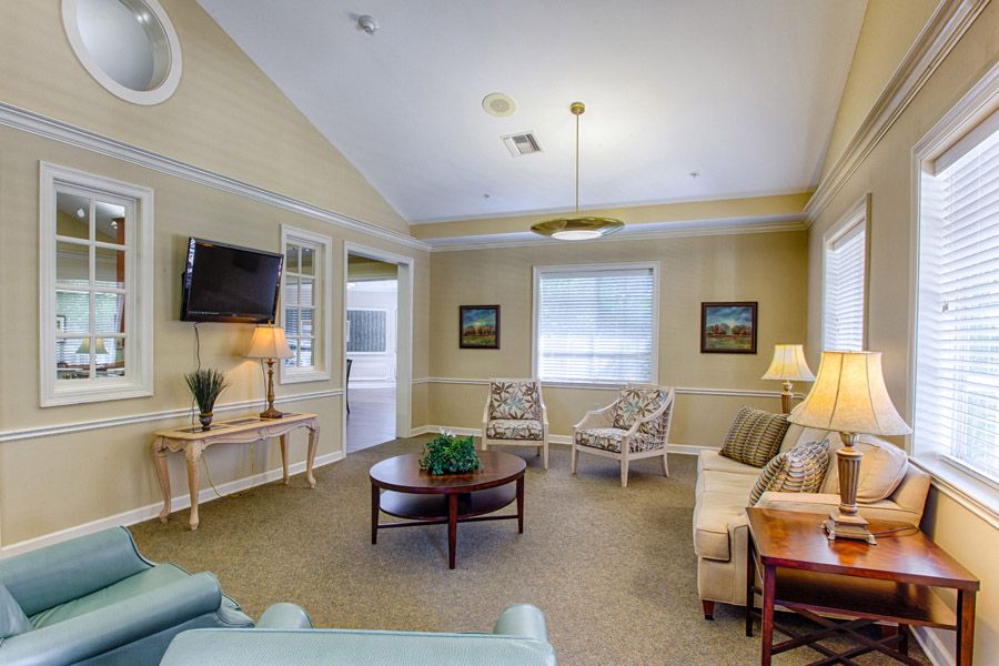 A cozy living room with comfortable seating and soft lighting.