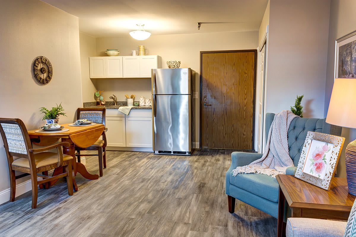 A cozy apartment kitchen and dining area with modern furnishings.