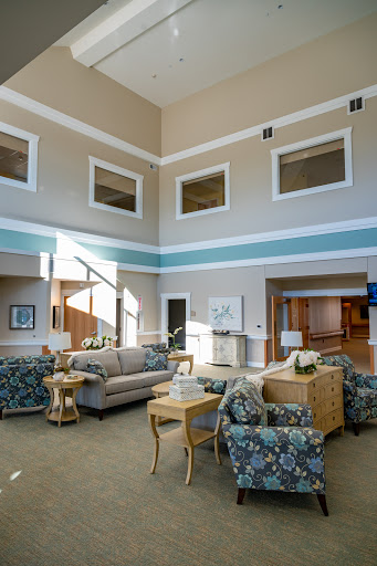 A spacious and inviting lobby area featuring comfortable seating, modern decor, and ample natural light.