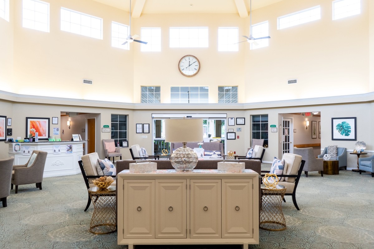 A well-lit lobby with comfortable seating and elegant decor.