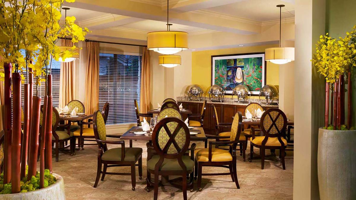 A cozy restaurant dining area with elegant seating and warm lighting.