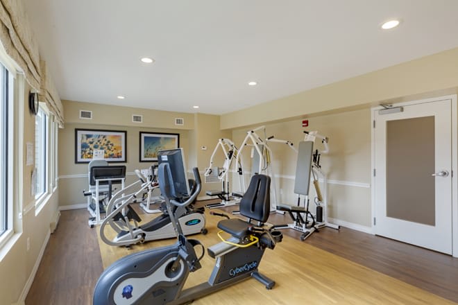 A well-equipped gym with various exercise machines and equipment.