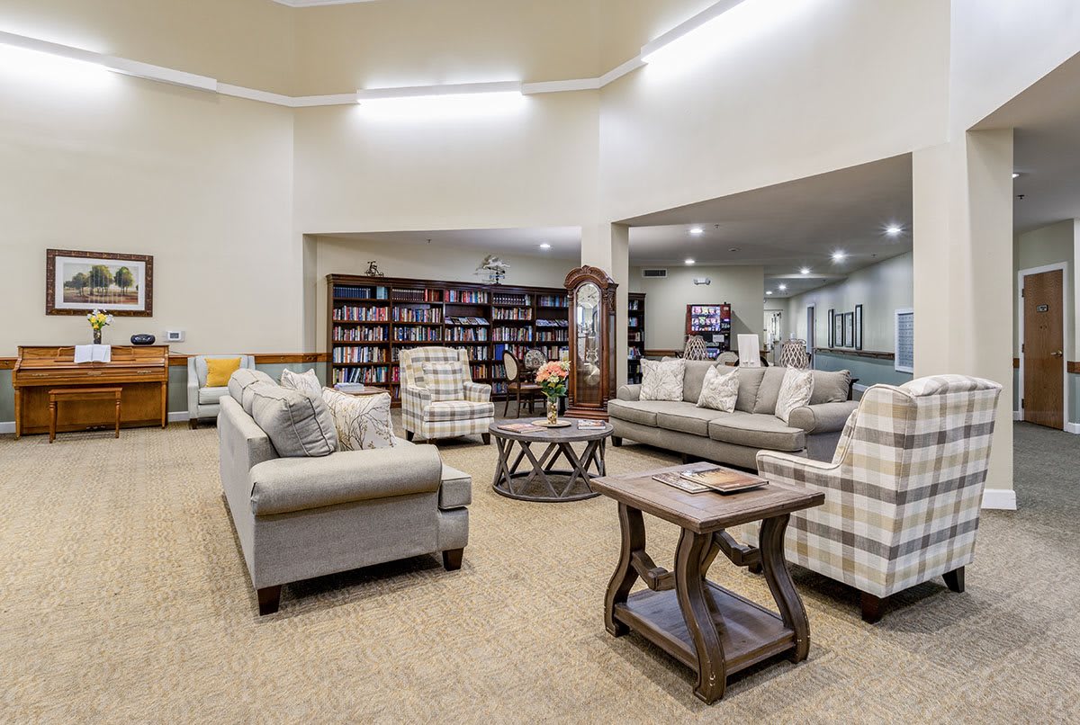 A cozy living room with comfortable sofas and a well-stocked bookshelf.
