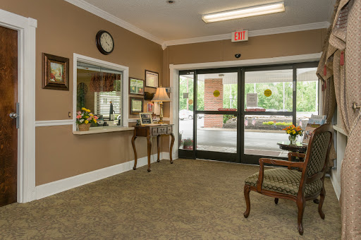 A welcoming lobby space featuring a reception desk, elegant furniture, and decorative elements.