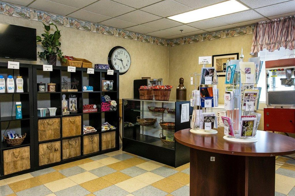 A small retail store interior displaying various products on shelves and counters.
