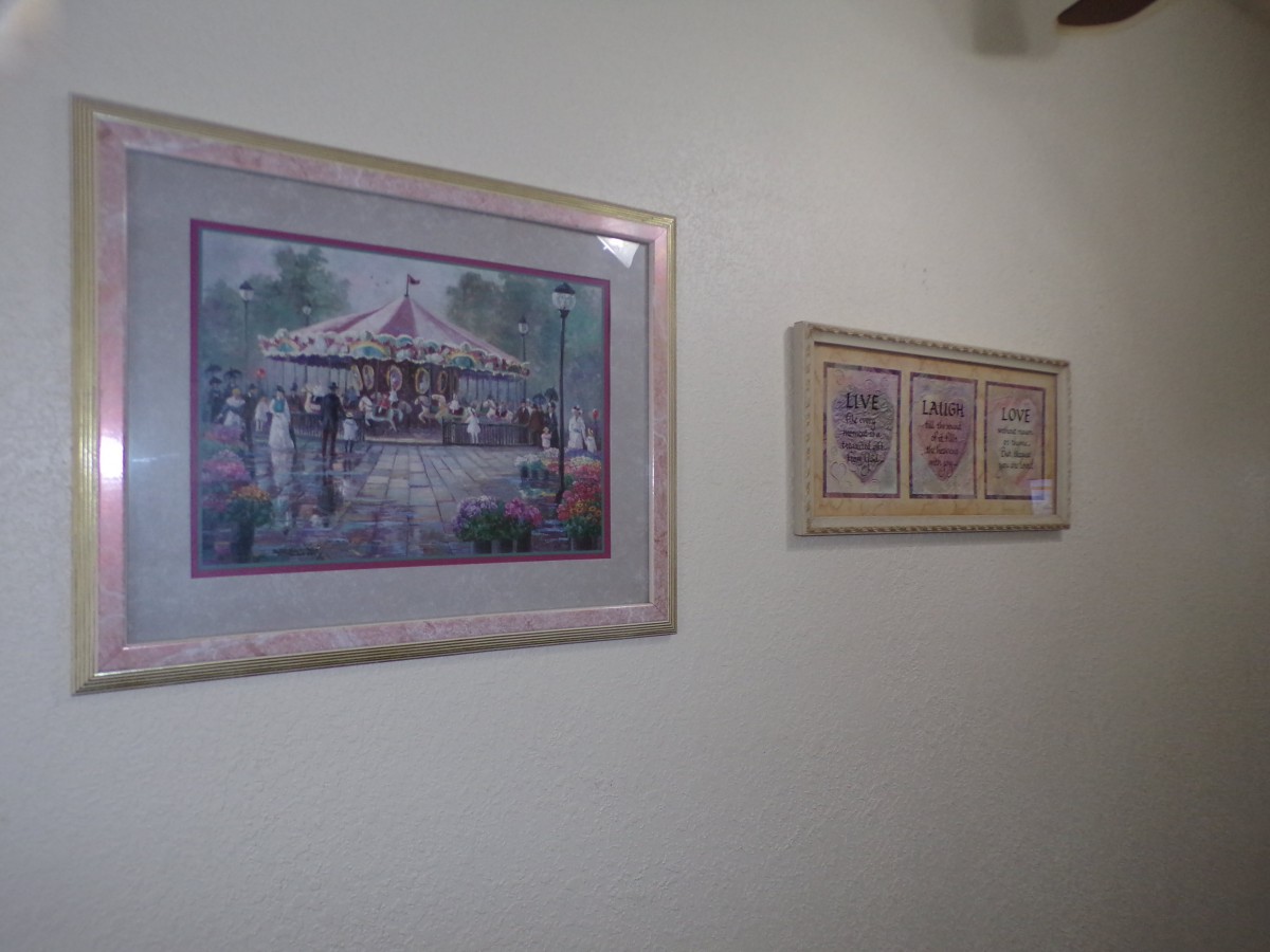 Framed artwork displayed on a gallery wall.