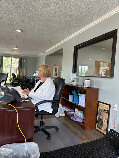 A woman working at her desk in a modern office environment.