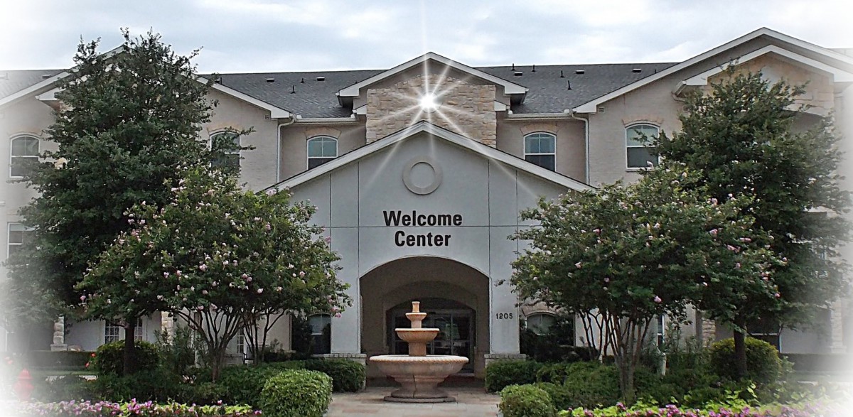 A welcome center with a fountain at the entrance.