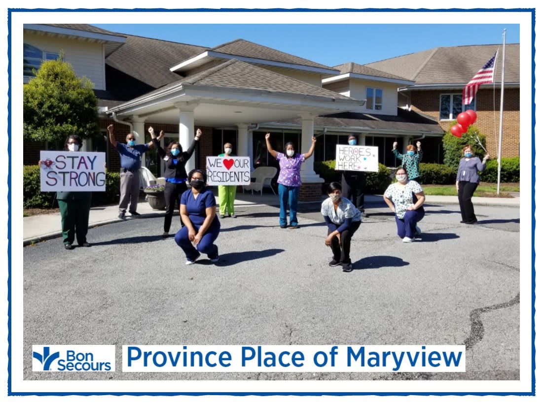 Healthcare workers at Province Place of Maryview showing support with signs.
