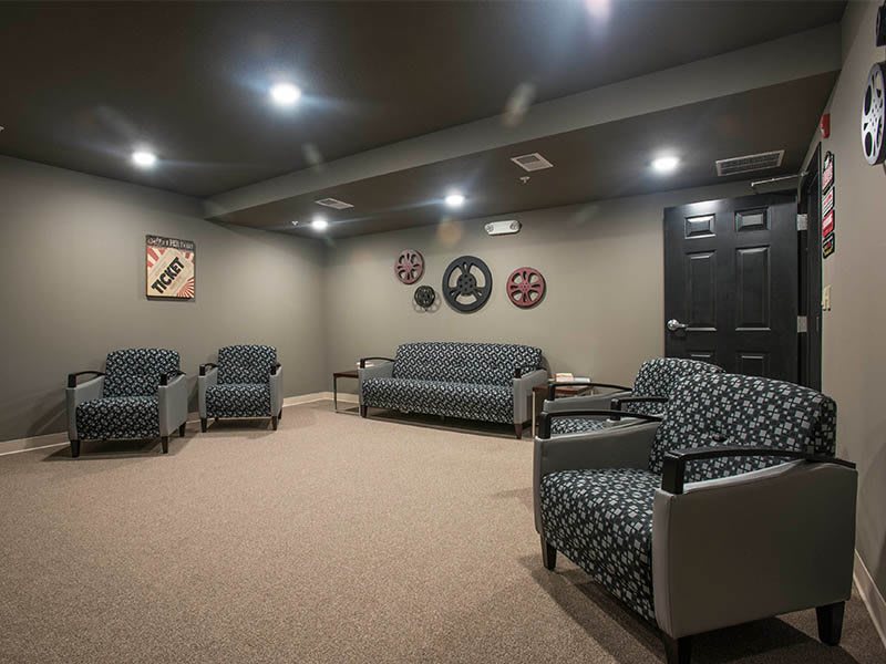 A cozy seating area with modern furniture and wall decor.