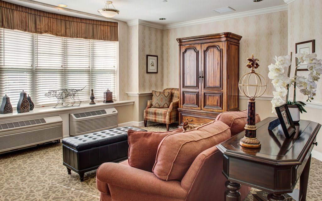 A cozy living room with classic furniture and natural lighting.
