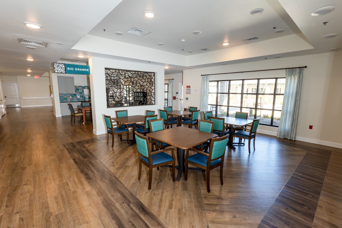 A modern dining area with wooden floors and stylish decor.