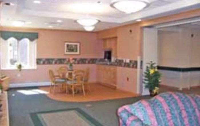 A cozy living room with a small dining area and comfortable seating arrangement.