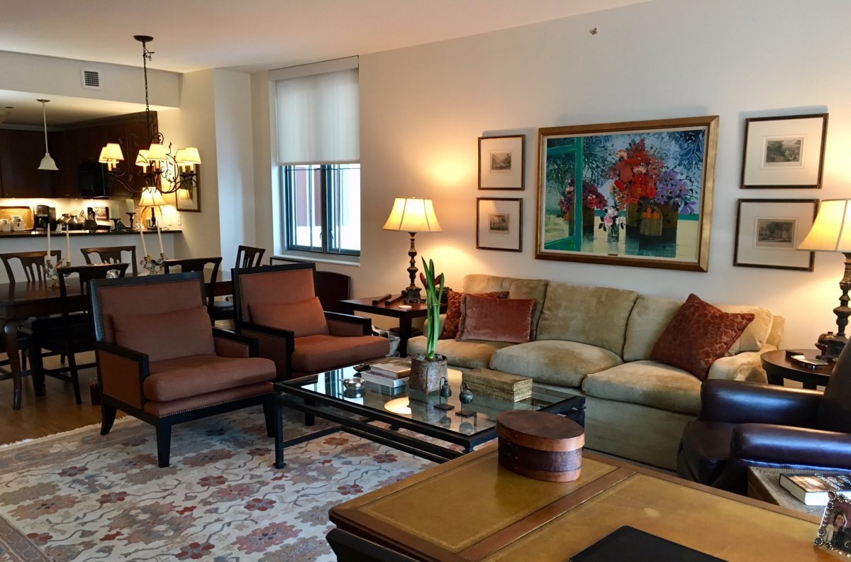 A cozy living room with elegant furniture and vibrant artwork.