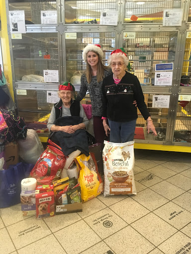 Local volunteers gather to support the animal shelter with generous donations during the holiday season.