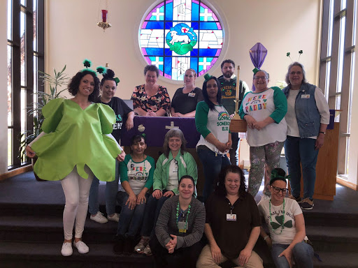 A lively group dressed in creative costumes gathered at the church for a fun event.