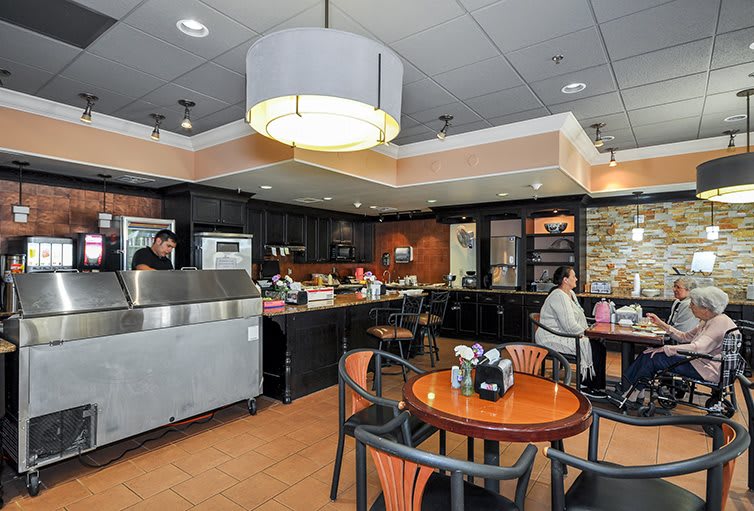 A cozy cafe interior with seating and customers enjoying their time.