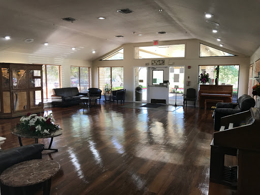 A spacious and inviting lobby featuring modern furniture and ample natural light.